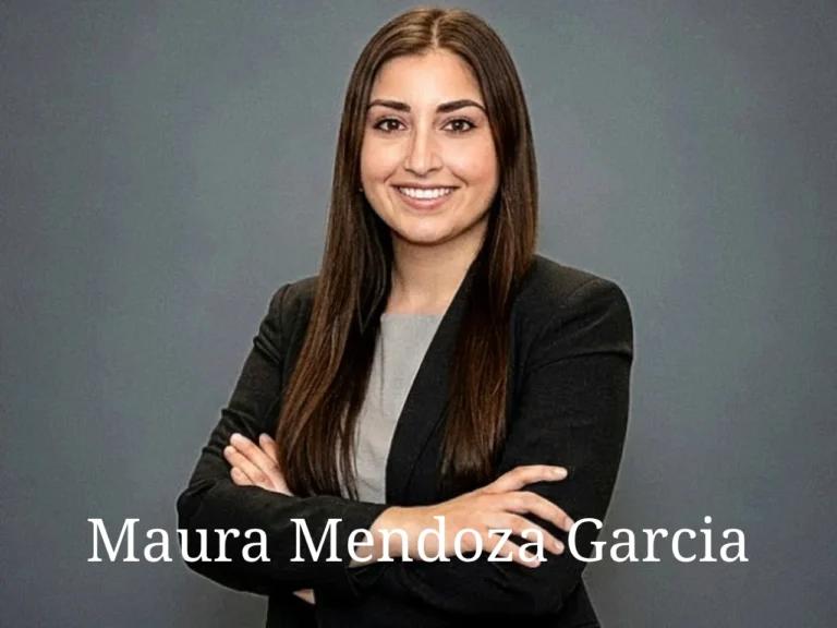 Maura Mendoza Garcia smiling while playing guitar and singing at a family arts event in Somerville Massachusetts