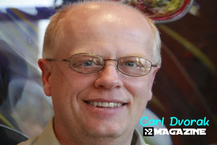 Who Is Carl Dvorak_ Carl Dvorak professional headshot - smiling businessman with glasses and blond hair